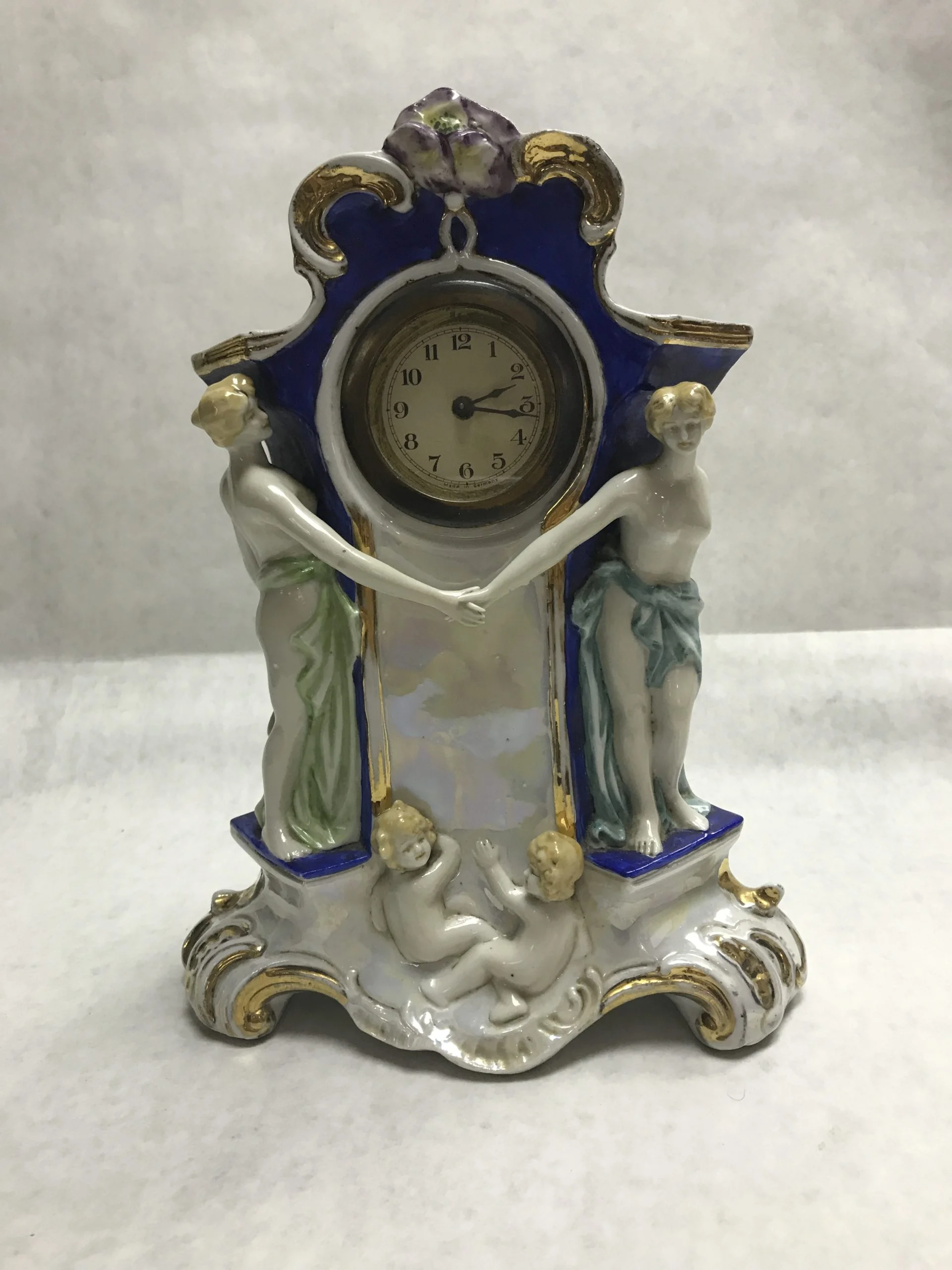 German porcelain figural wind-up clock
